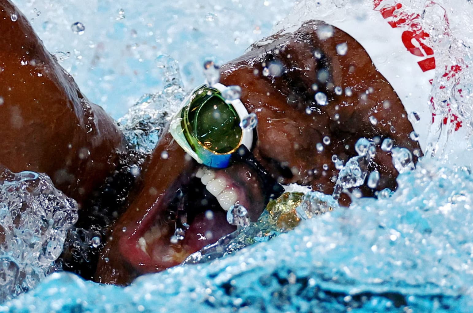 Congolese swimmer Vanessa Bobimbo nearly loses her goggles during the women’s 50m freestyle.